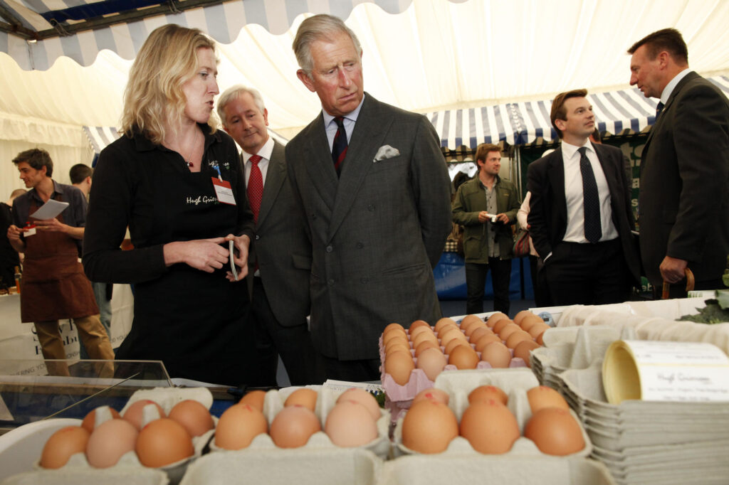 King Charles looks at a display of eggs