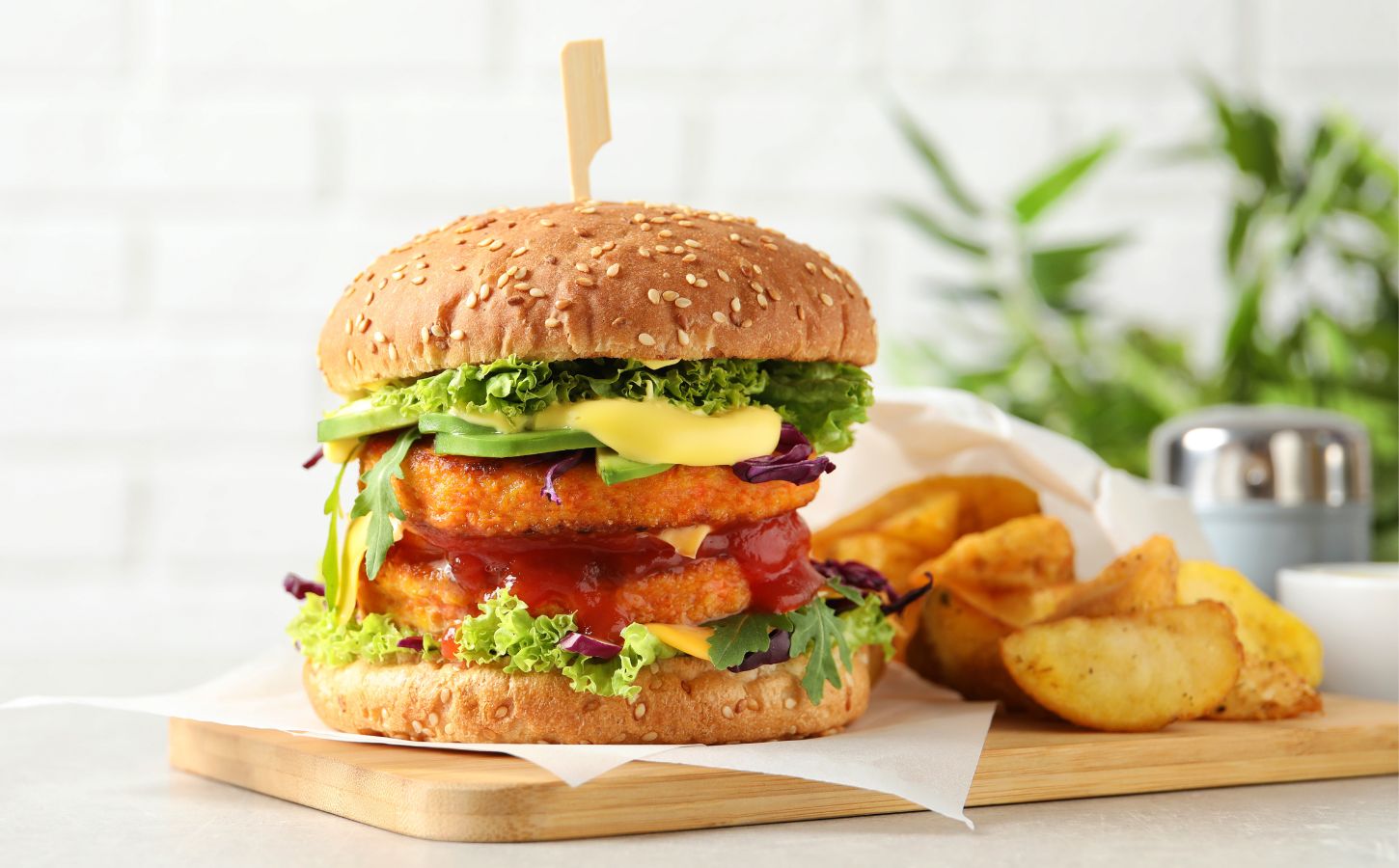 A vegan burger on a wooden plate