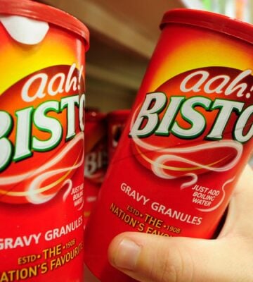 A person picks up Bisto gravy from the supermarket shelf