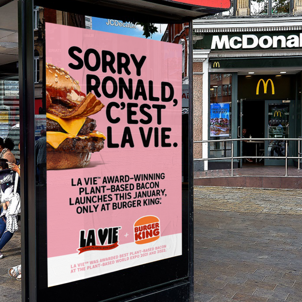 Advertisement for La Vie bacon outside a McDonald's