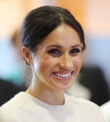 Duchess of Sussex Meghan Markle smiling at an event