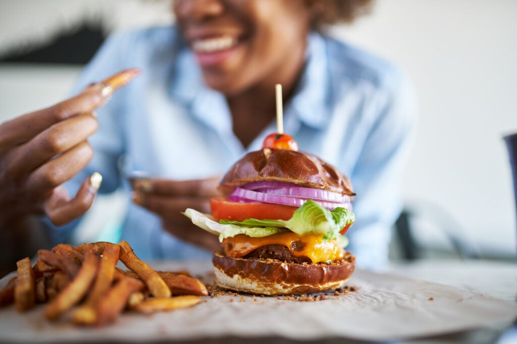 Woman eating vegan burger