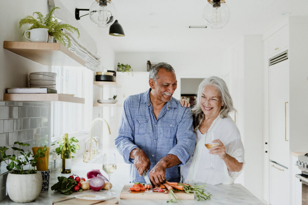 A couple cooking with vegan food in the kitchen 