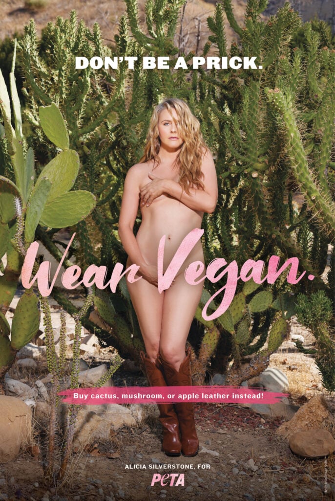 Vegan actor Alicia Silverstone poses naked wearing cowboy boots in front of some cacti
