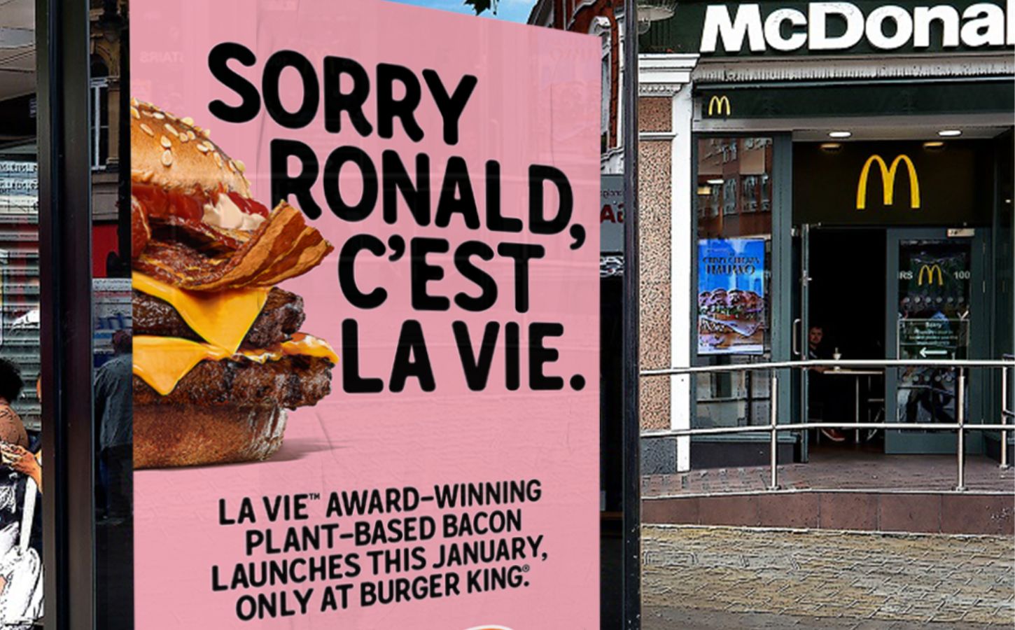 A Burger King advert for La Vie vegan bacon outside a McDonald's