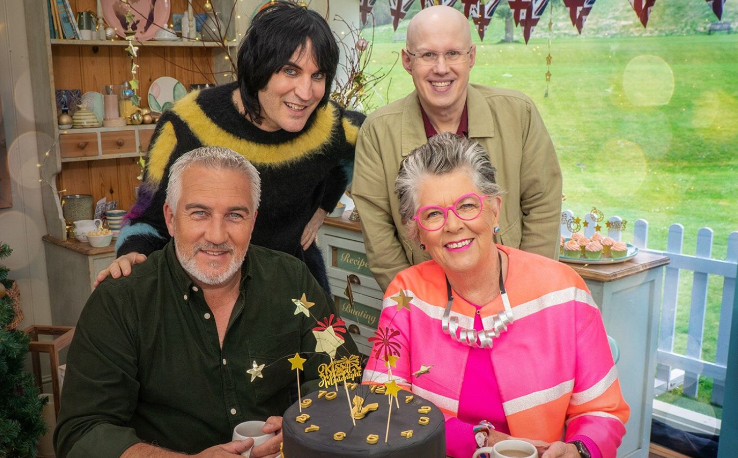 The Great British Bake Off judges Paul Hollywood and Prue Leith sitting in front of hosts Noel Fielding and Matt Lucas