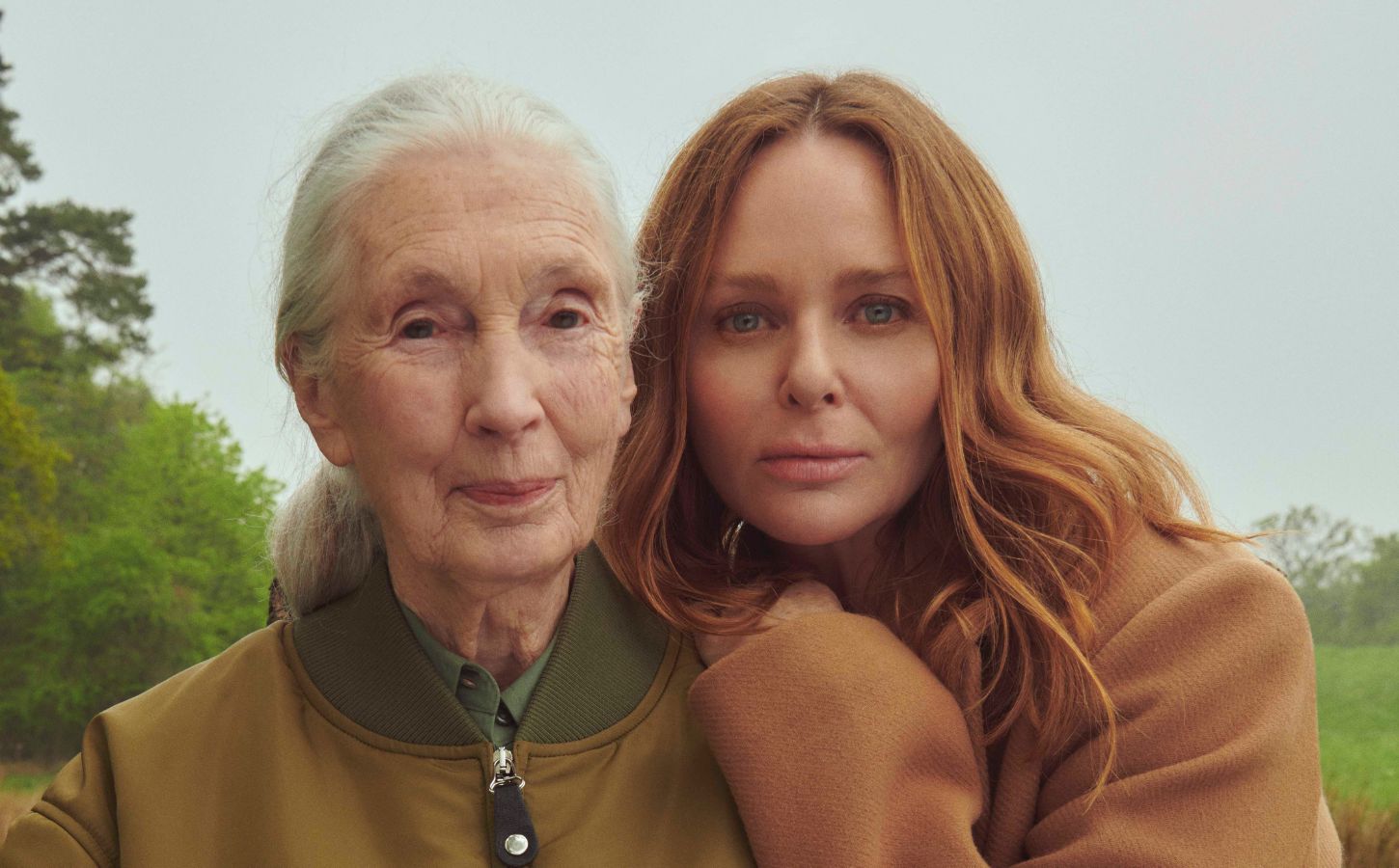 Stella McCartney and Jane Goodall pose for a picture in a field as they collaborate for STELLA skincare