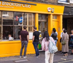 People queue outside London restaurant The Breakfast Club, which has gone vegan and vegetarian for Veganuary 2023