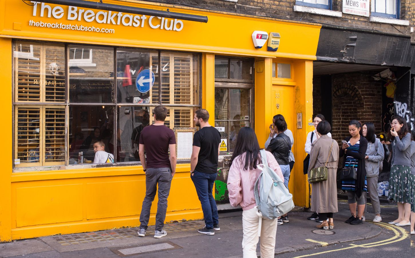 People queue outside London restaurant The Breakfast Club, which has gone vegan and vegetarian for Veganuary 2023