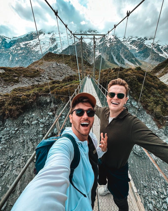 Vegan travelers Oskar and Dan on a bridge