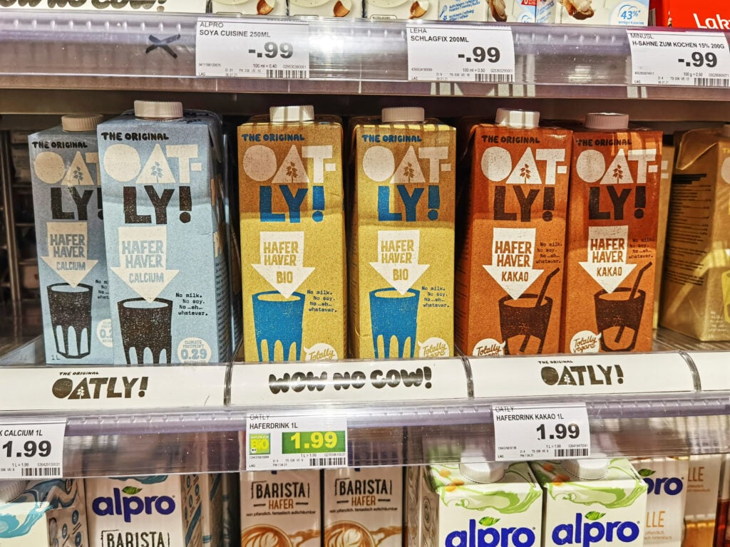 A selection of plant-based dairy milks in a supermarket