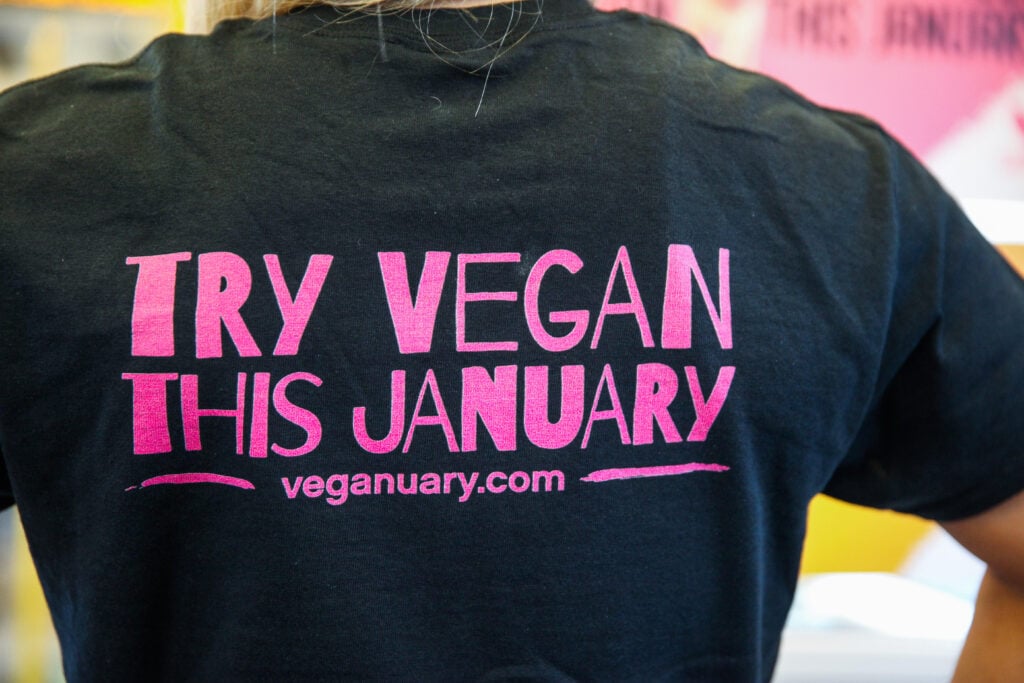 A person wearing a Veganuary t-shirt