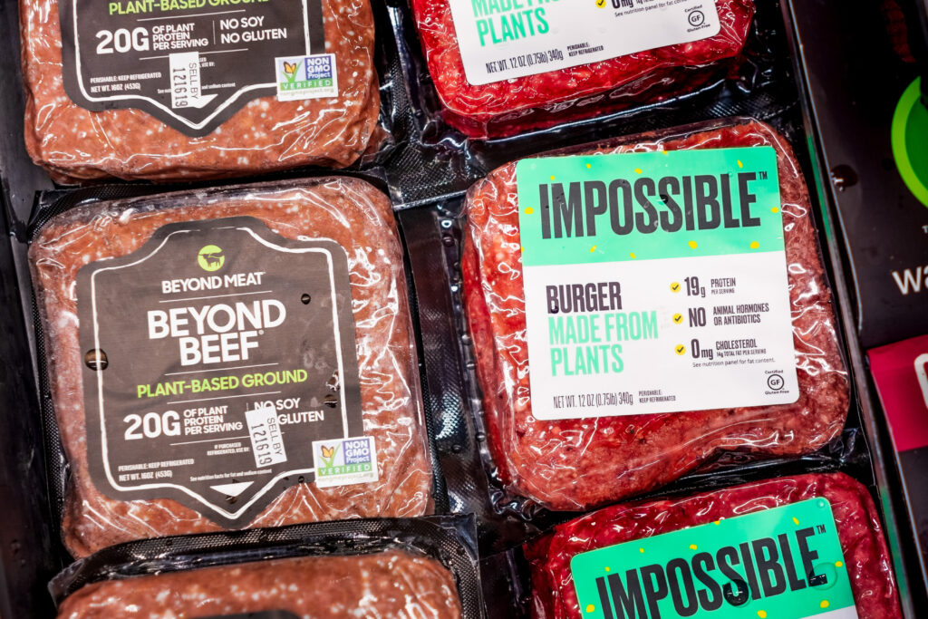 Vegan food products with meat-like labels in a supermarket