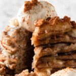 Vegan apple-pie flavored pancakes with dairy-free ice cream on top