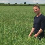 Former dairy cow farmer Laurence Candy, who has turned his farm vegan, standing in a field