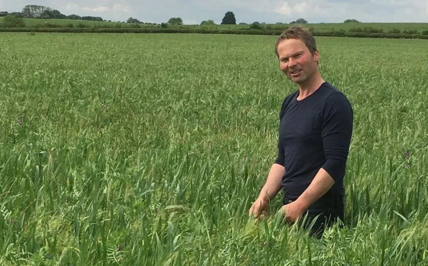 Former dairy cow farmer Laurence Candy, who has turned his farm vegan, standing in a field