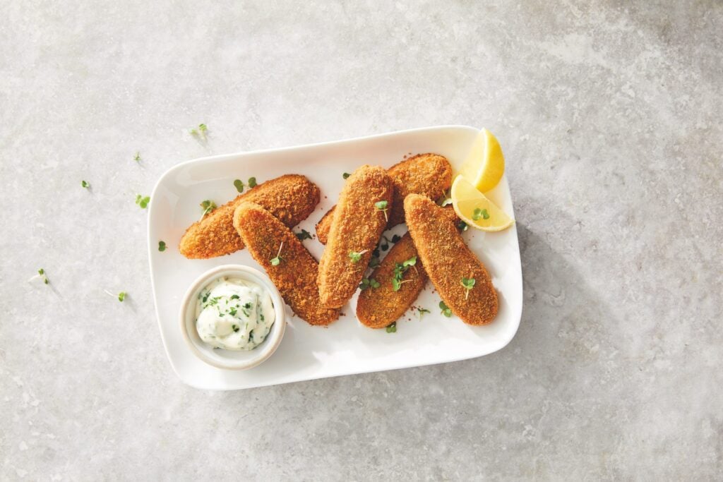 Aldi's Plant Menu vegetable dippers on a white plate and served with vegan mayo