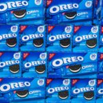 A supermarket shelf full of vegan chocolate biscuits Oreos, featuring dairy-free cookie cream