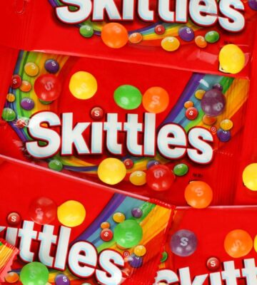 A close up shot of packets of vegan sweets, made by candy brand Skittles