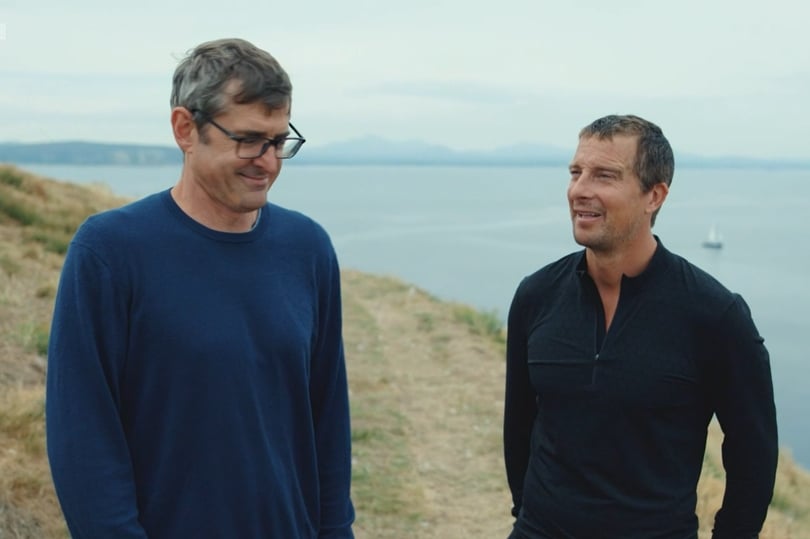 Bear Grylls and Louis Theroux walking on a clifftop discussing diet and veganism