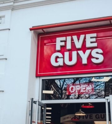 The exterior of a Five Guys fast-food restaurant in the UK