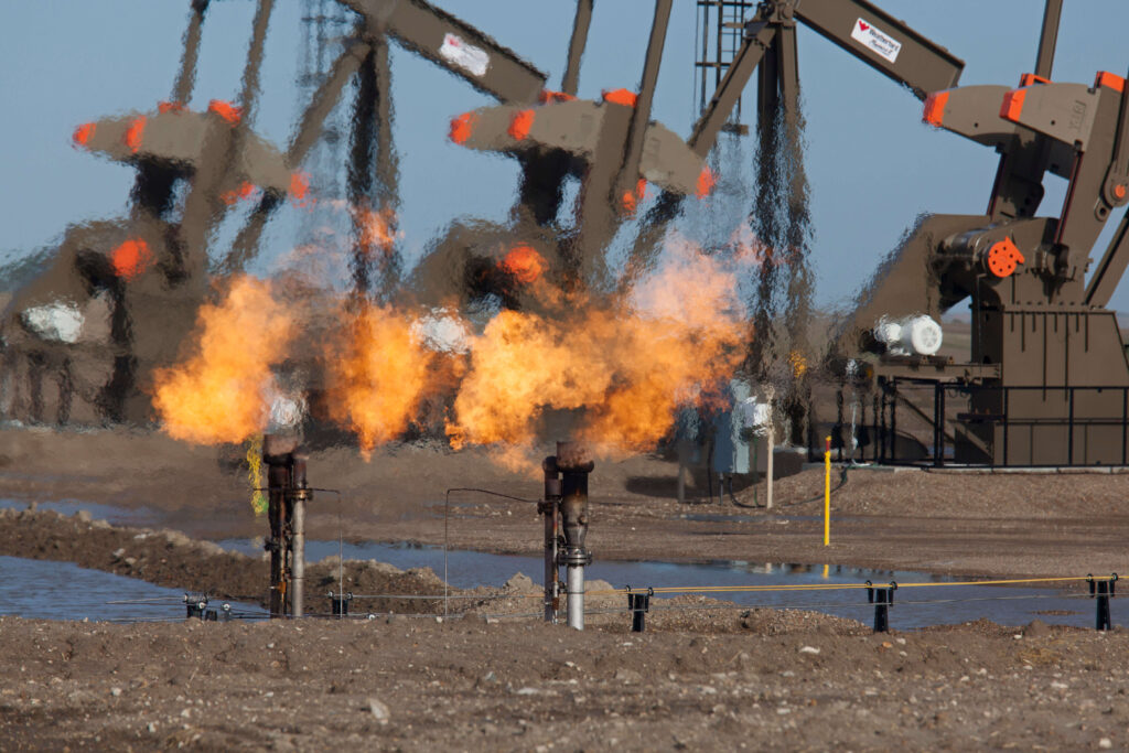 Natural gas is flared off as oil is pumped in Watford City, North Dakota