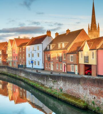 Town houses overlooking the river Yare at Norwich, which is promoting vegan food via the Plant Based Treaty