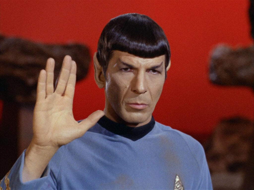 Spock, played by Leonard Nimoy, giving a Vulcan hand greeting in Star Trek, which is said to have vegan messaging
