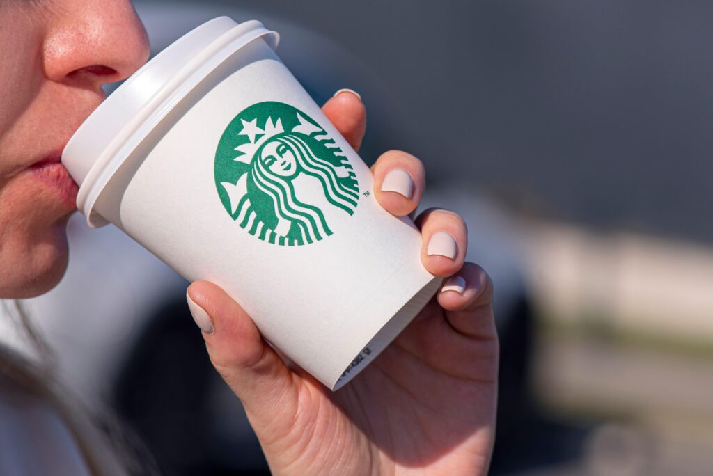 A person drinking a vegan drink from Starbucks in Germany