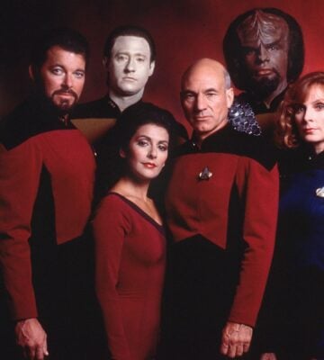The cast of Star Trek Next Generation, said to contain vegan messaging, stood in front of a red background