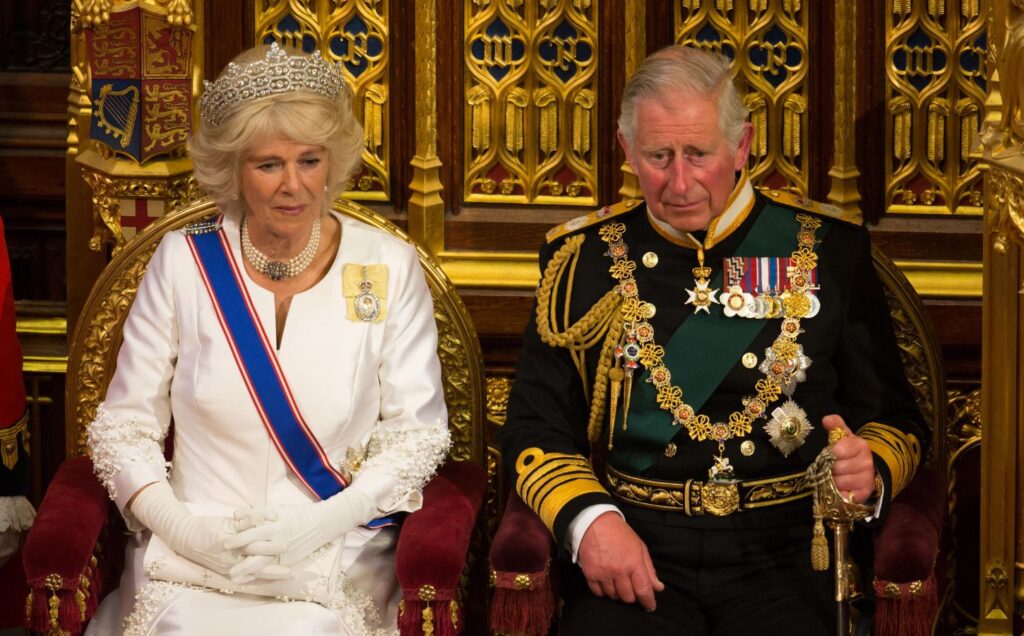 King Charles and Queen Consort Camilla sat in thrones