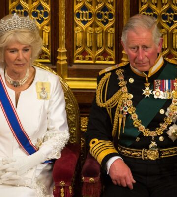 King Charles and Queen Consort Camilla sat in thrones