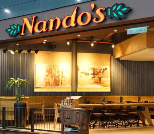 The outside of a Nando's restaurant, which has a number of vegan and vegetarian options