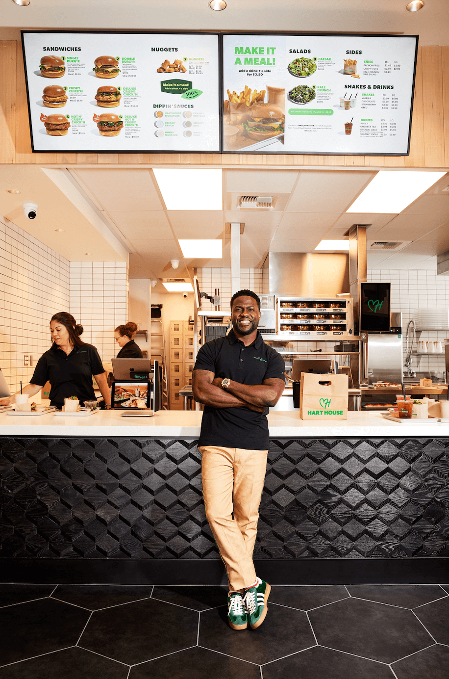 Kevin Hart, founder of vegan fast-food chain Hart House, standing in the new Hollywood drive-thru location