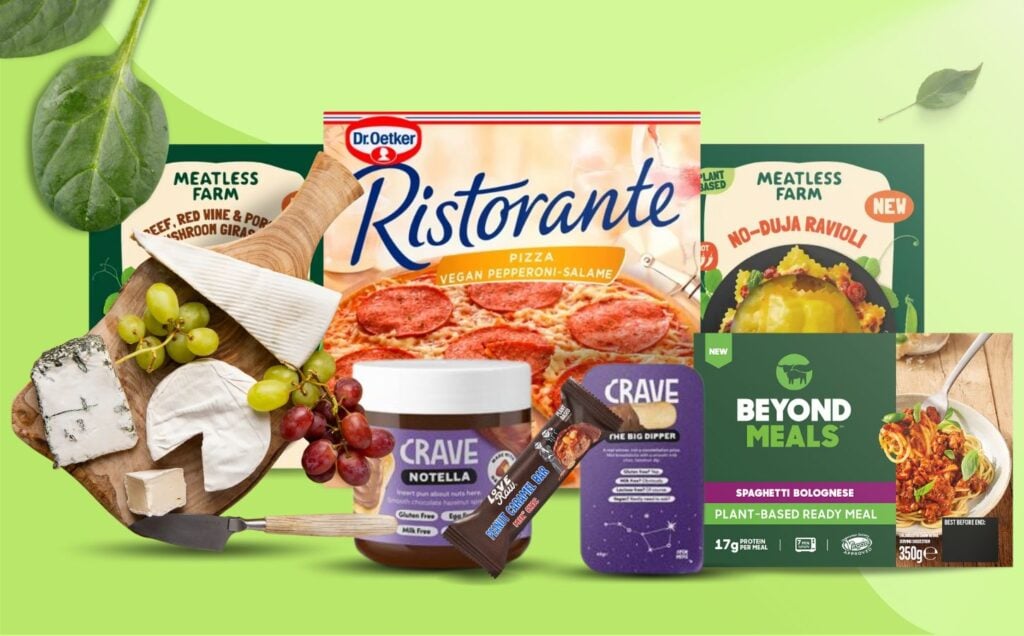 A selection of newly-released vegan food products from the UK, including pasta, cheese, chocolate, and pizza