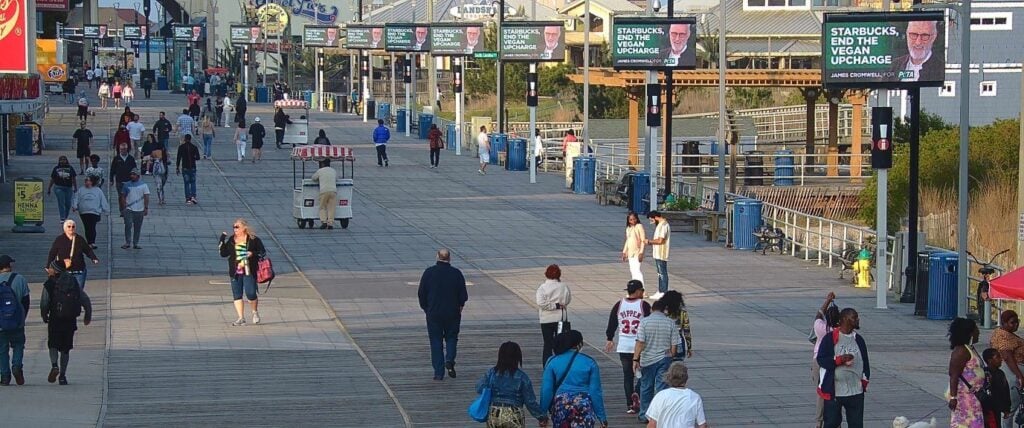 The Atlantic City Boardwalk in New Jersey, with ads by PETA and James Cromwell about Starbucks vegan milk surcharge