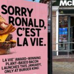A LA VIE bus stop advert outside McDonald's with the words: "Sorry Ronald, C'est La Vie" written next to a plant-based burger