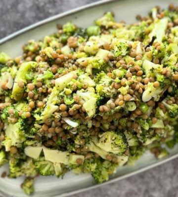 Lentil and broccoli vegan summer salad served on a rectangular platter