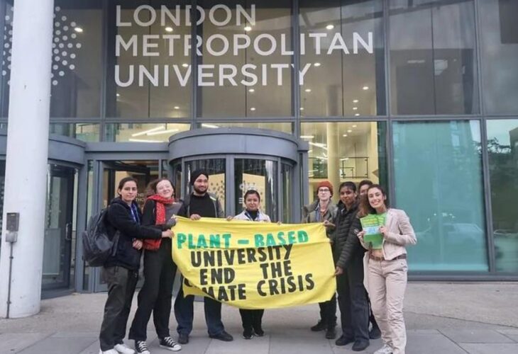 Students outside London Metropolitan University holding a banner that says: "Plant-based university end the climate crisis"