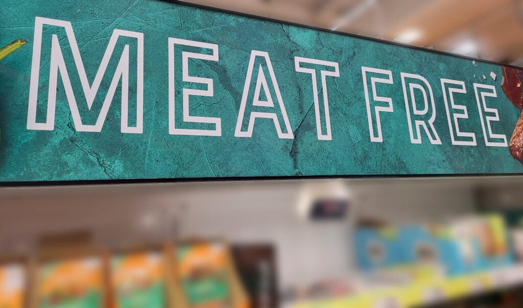 A sign in the vegan area of a UK supermarket reading "meat free"