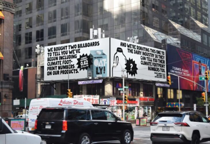 An Oatly billboard that challenges Big Dairy to reveal its environmental impact, in Times Square