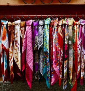 A selection of brightly colored scarves made from silk, a material often considered to be cruel
