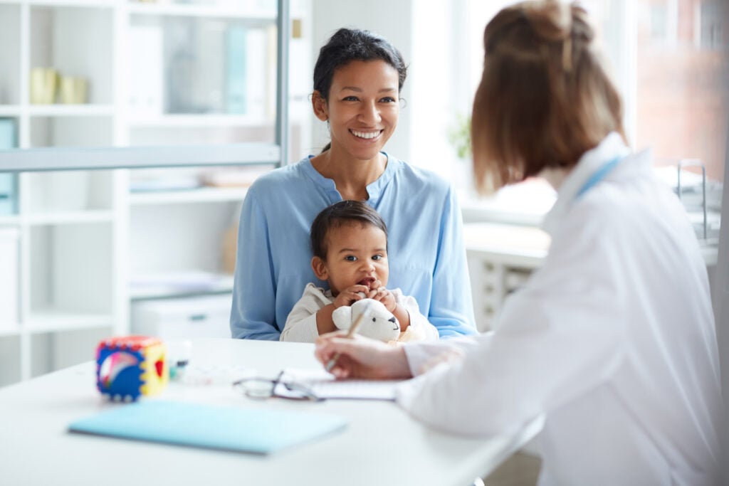 A mum and her young baby at the doctors' office