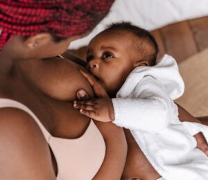 A vegan mother breastfeeding her baby