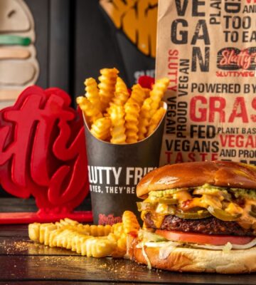 A plant-based burger, fries, and drink made by Slutty Vegan, just named one of Yelp's favorite burger chains