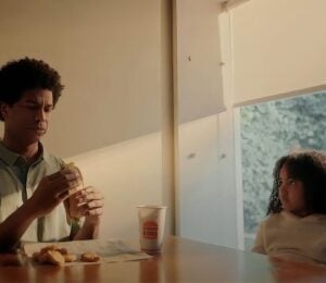 A child eating vegan chicken with her dad in a Burger King "confusing times" advert