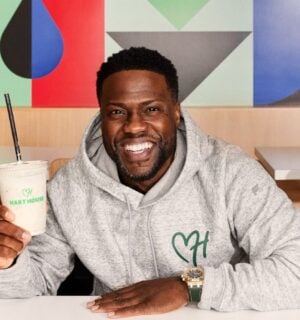 Kevin Hart, founder of vegan fast-food chain Hart House, sitting in the new Hollywood drive-thru location