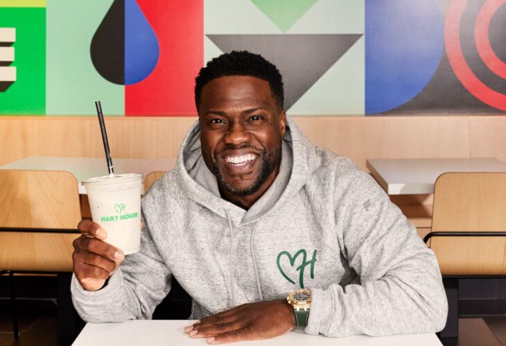 Kevin Hart, founder of vegan fast-food chain Hart House, sitting in the new Hollywood drive-thru location