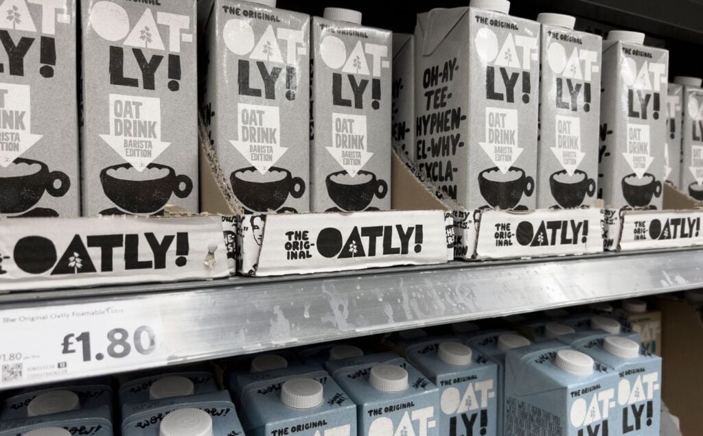 A selection of Oatly vegan oat milk drinks at a UK supermarket
