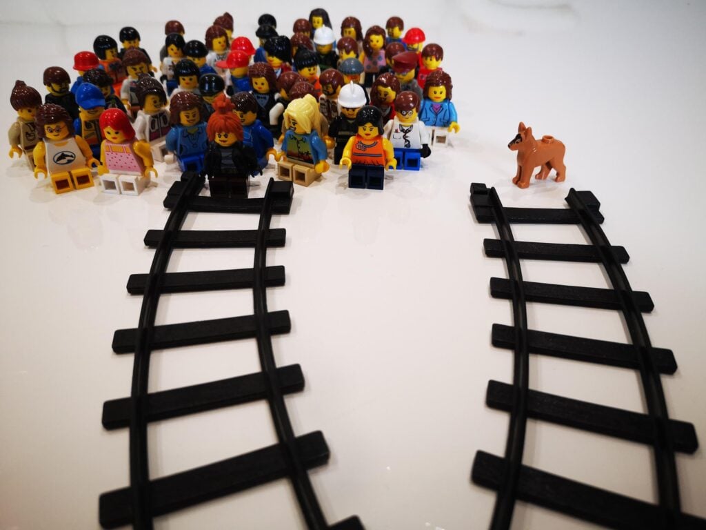 Lego figurines of people and non-human animals, which were used to depict the trolley problem to children and adults
